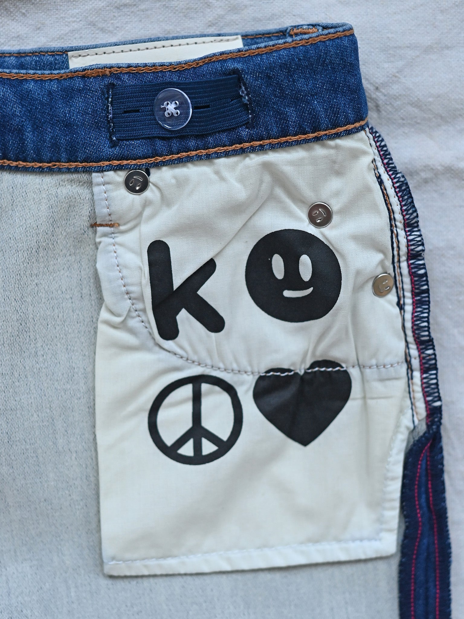 Kudro Kids The Destroy Straight leg denim jeans with printed logo on inner pocket