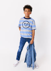 kudro kids destroy skinny jean full shot on boy model holding denim shirt