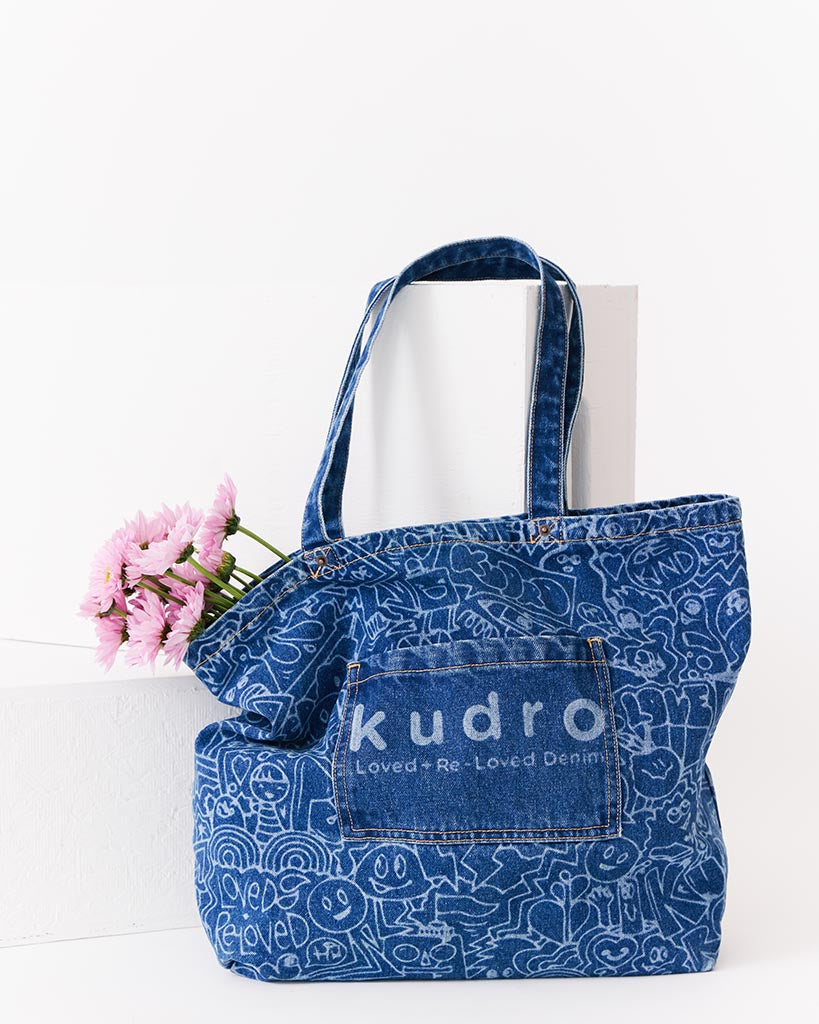 The Tote Kudro Kids tote bag made from sustainable denim with pink flowers