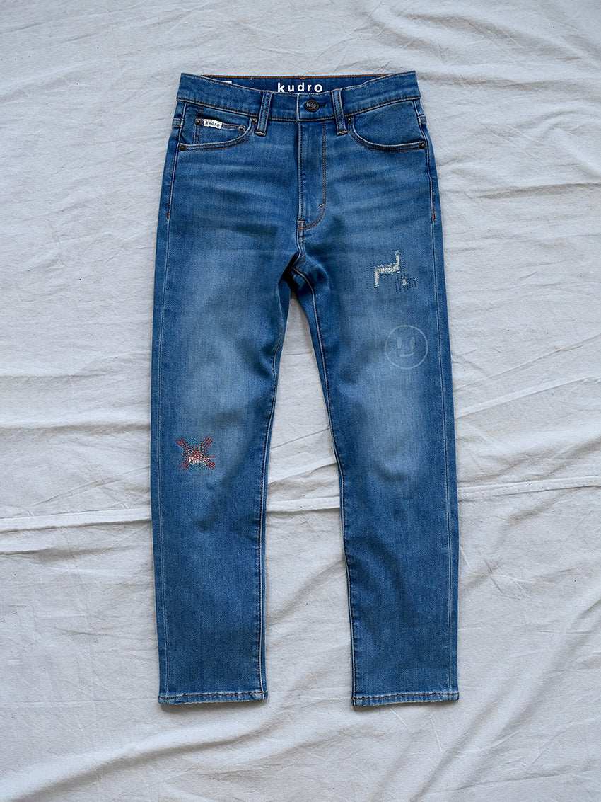 Kudro Kids The Repair Skinny leg denim jeans front with unique design elements including embroidered and scuffed patch