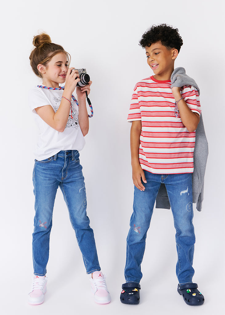 kudro kids repair skinny jean full shot on boy and girl model with camera