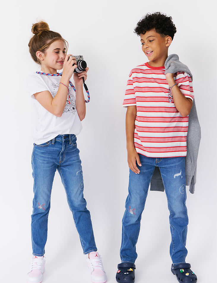 kudro kids repair skinny jean full shot on boy and girl model with camera