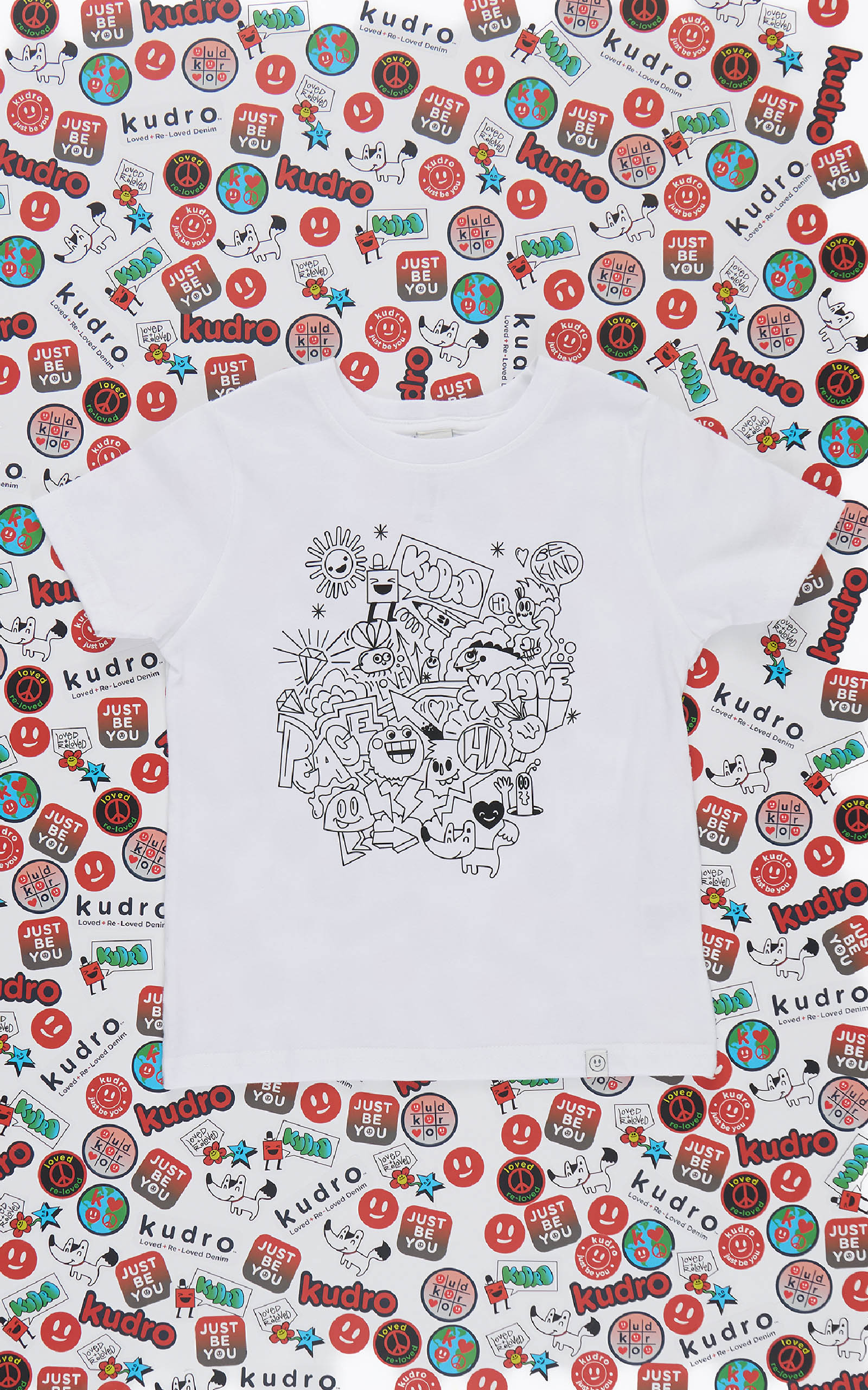 White shirt with black doodle graphic design and 'Kudro' branding on a patterned background