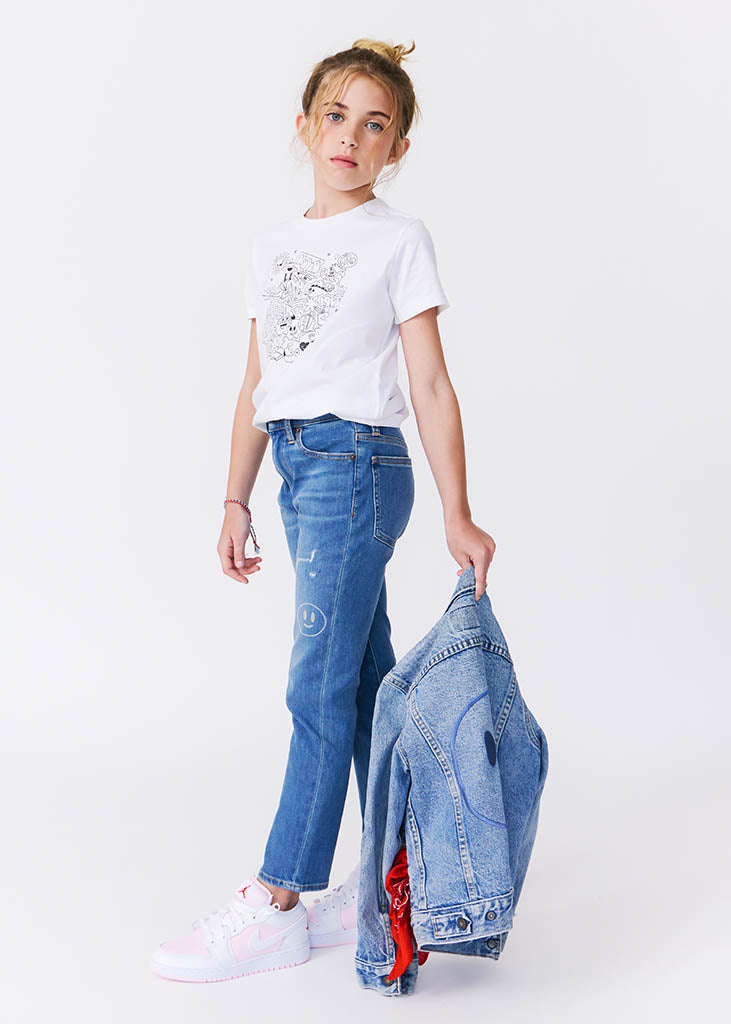 kudro kids repair skinny jean side view full shot on girl model holding denim jacket