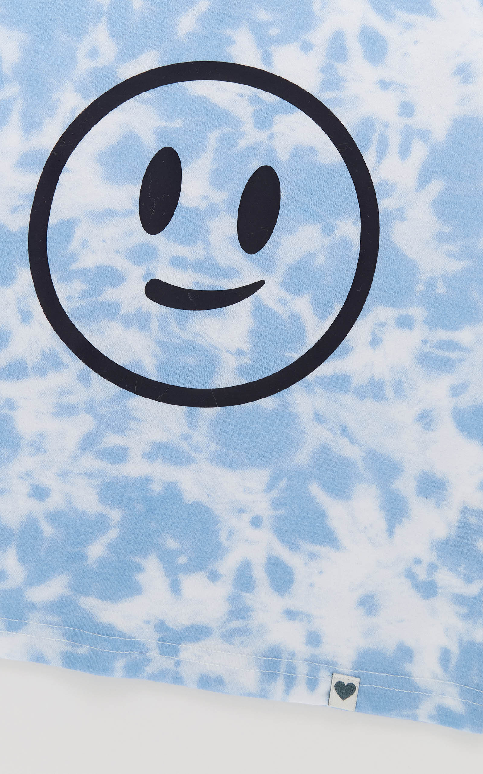 Smiley face symbol on a blue textured background