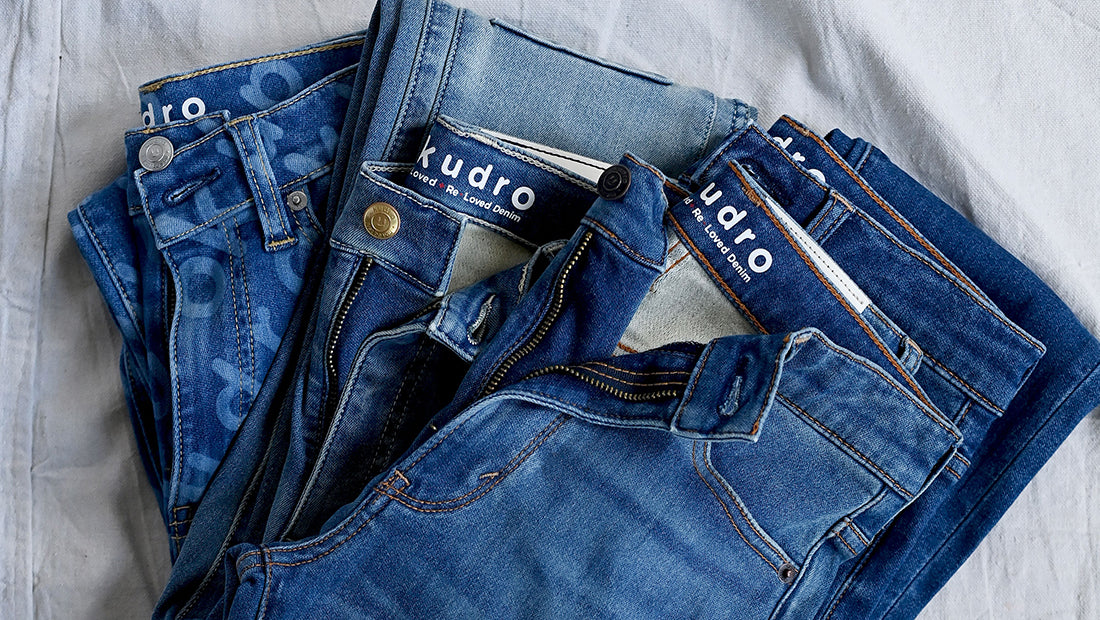 Collection of Kudro Kids jeans laid out showing inner print branding and high quality stitch